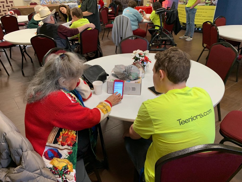 Two people learning something using a phone