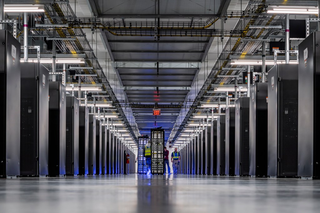 A group of people working in a server hall