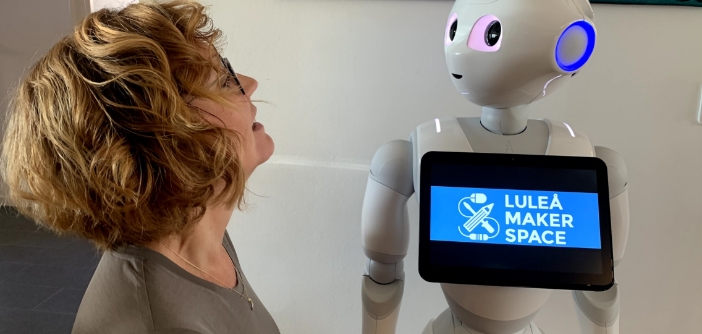 Woman looking at a robot