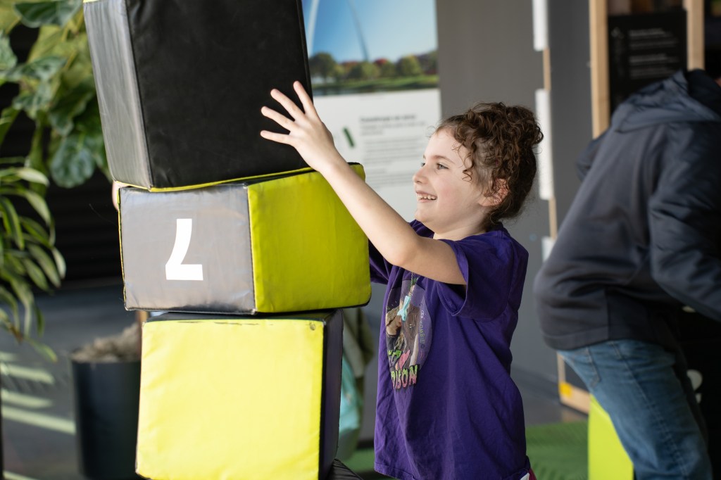 A girl playing with cubes