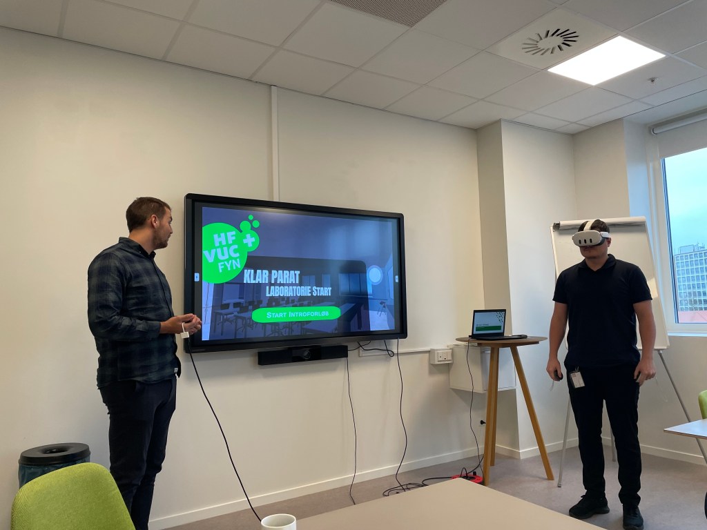 A student wearing a Meta Quest headset together with another adult in a learning setting.